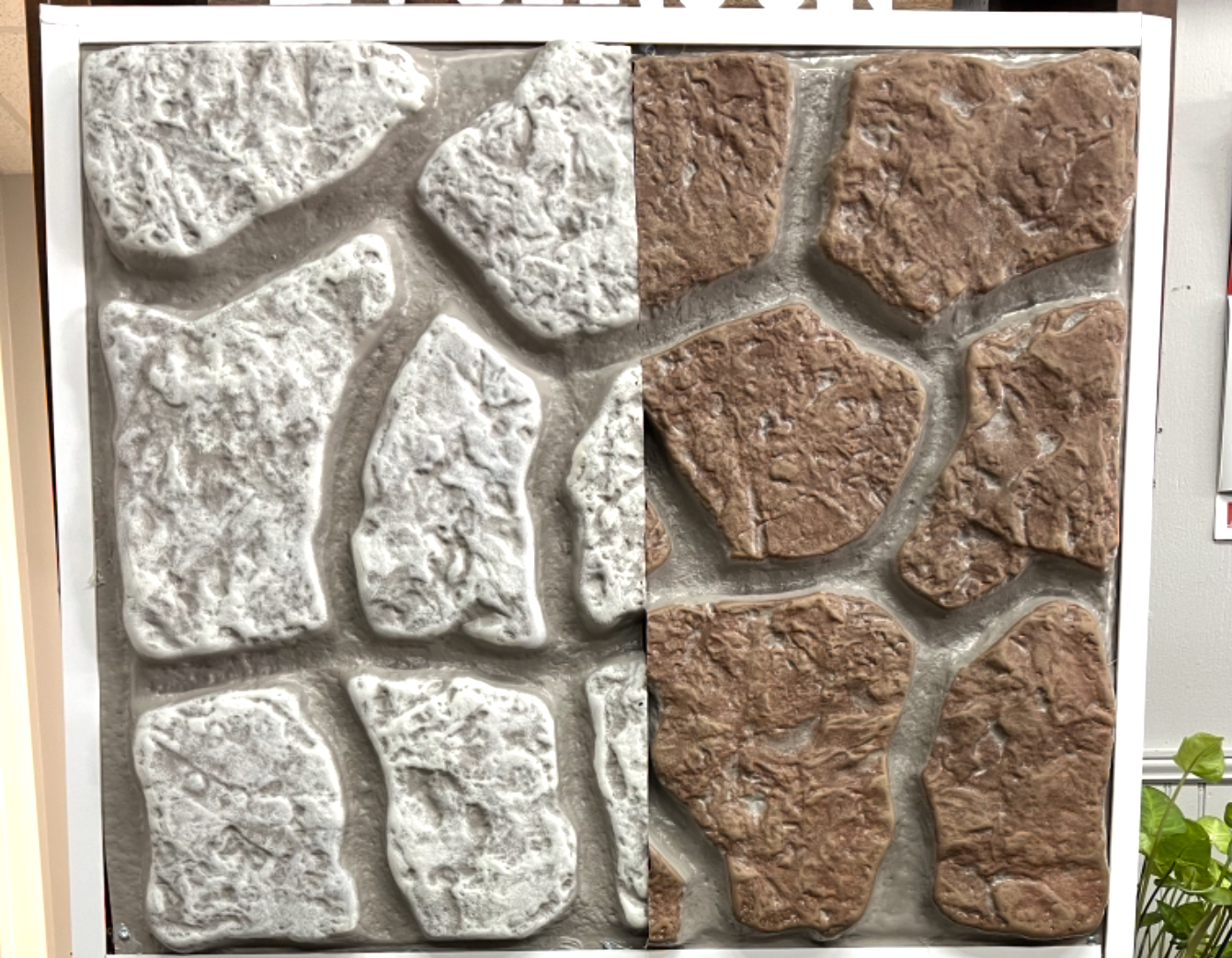 There are two different types of rocks on the wall.