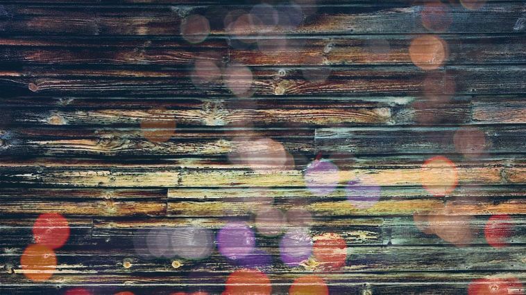 a close up of a wooden wall with a blurred background .