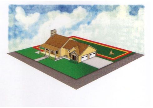 An aerial view of a house with a lawn in front of it