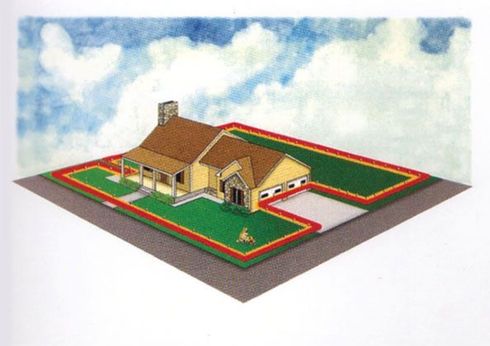 An aerial view of a house with a fence around it