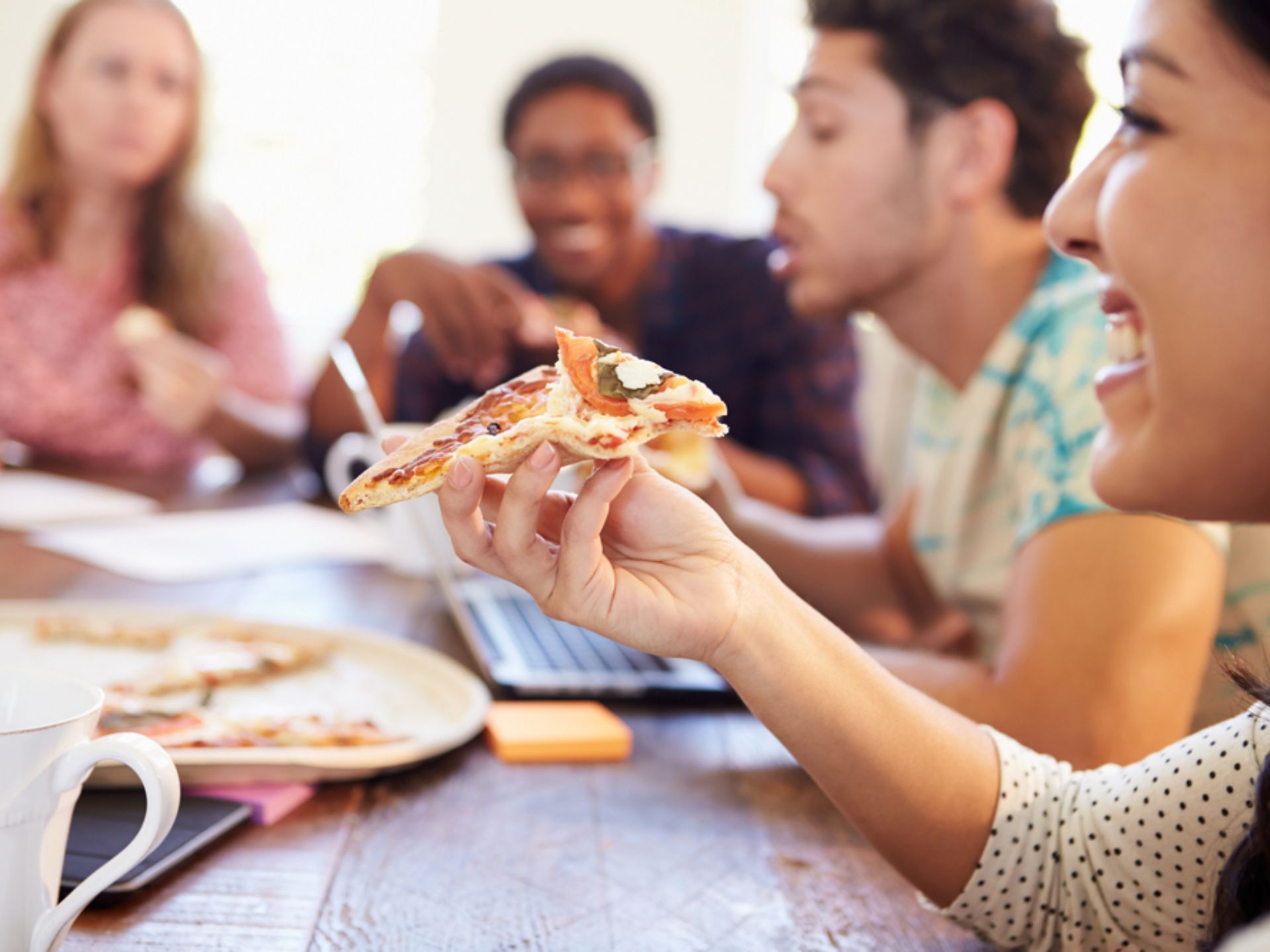 Friends eating a meal at Woodview at Randolph.