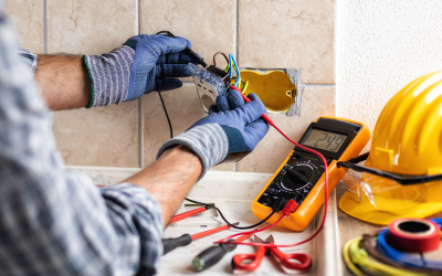 Electrician testing outlet