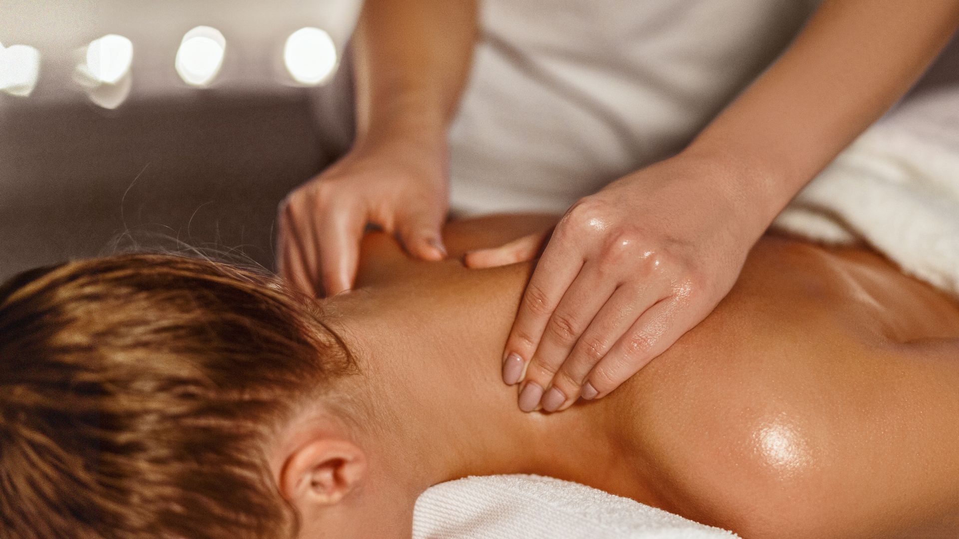 A woman is getting a massage at a spa.