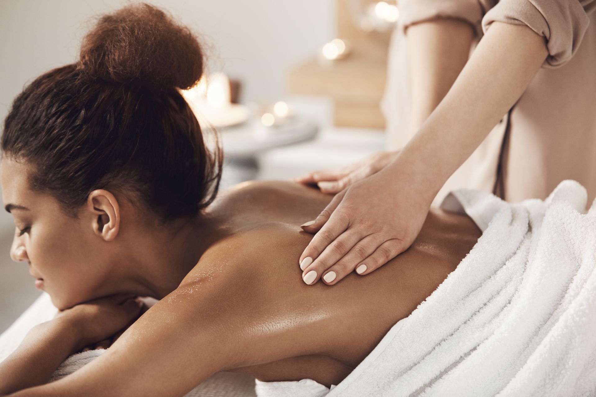 A woman is getting a massage in a spa.