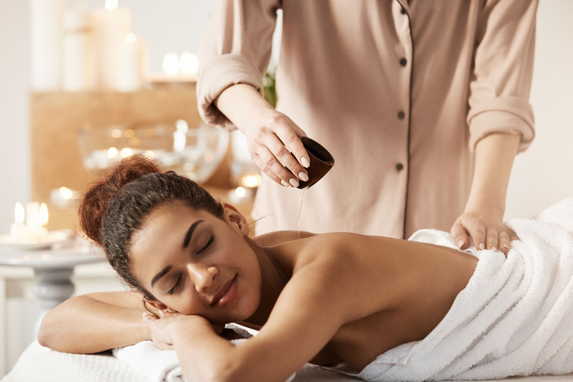 A woman is getting a massage at a spa.