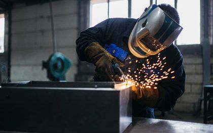 Steel fabricator using blow torch