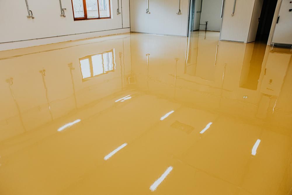 Yellow, Glossy Epoxy Floor Reflecting Sunlight — AB QUICK Painting & Maintenance Services In Mareeba, QLD