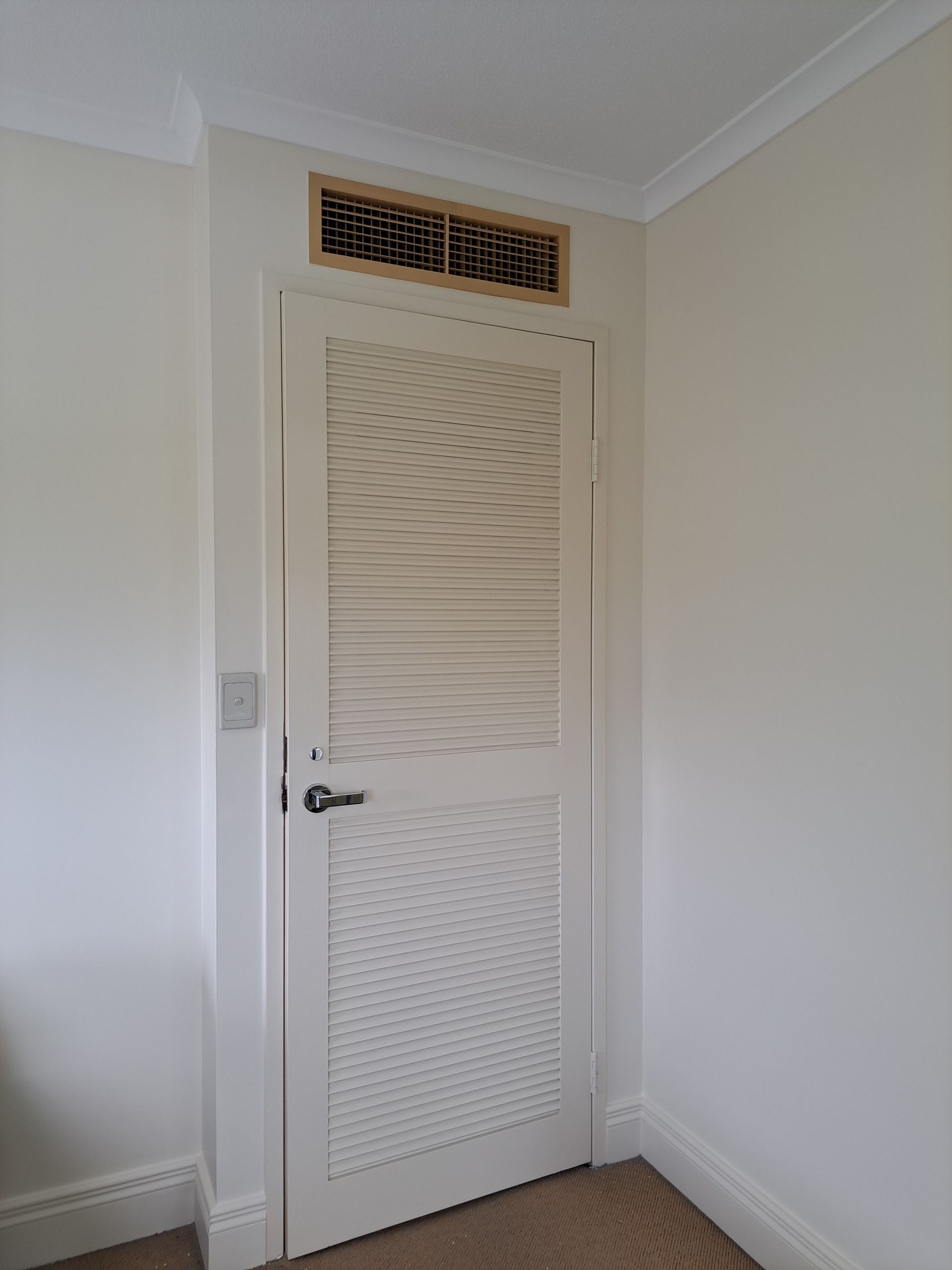 Close-up of Wooden Door With a Silver Handle — AB QUICK Painting & Maintenance Services In Mareeba, QLD