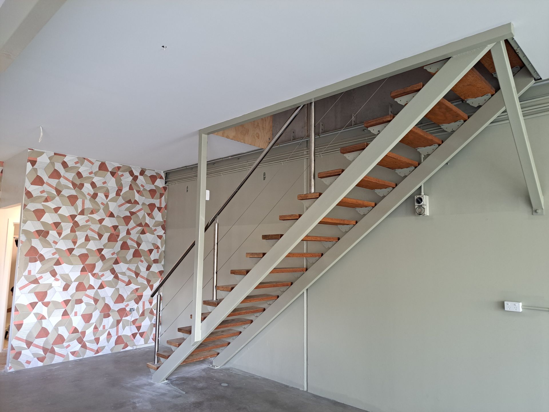 Wooden Staircase and Door in a Home, With Built-in Shelves — AB QUICK Painting & Maintenance Services In Mareeba, QLD