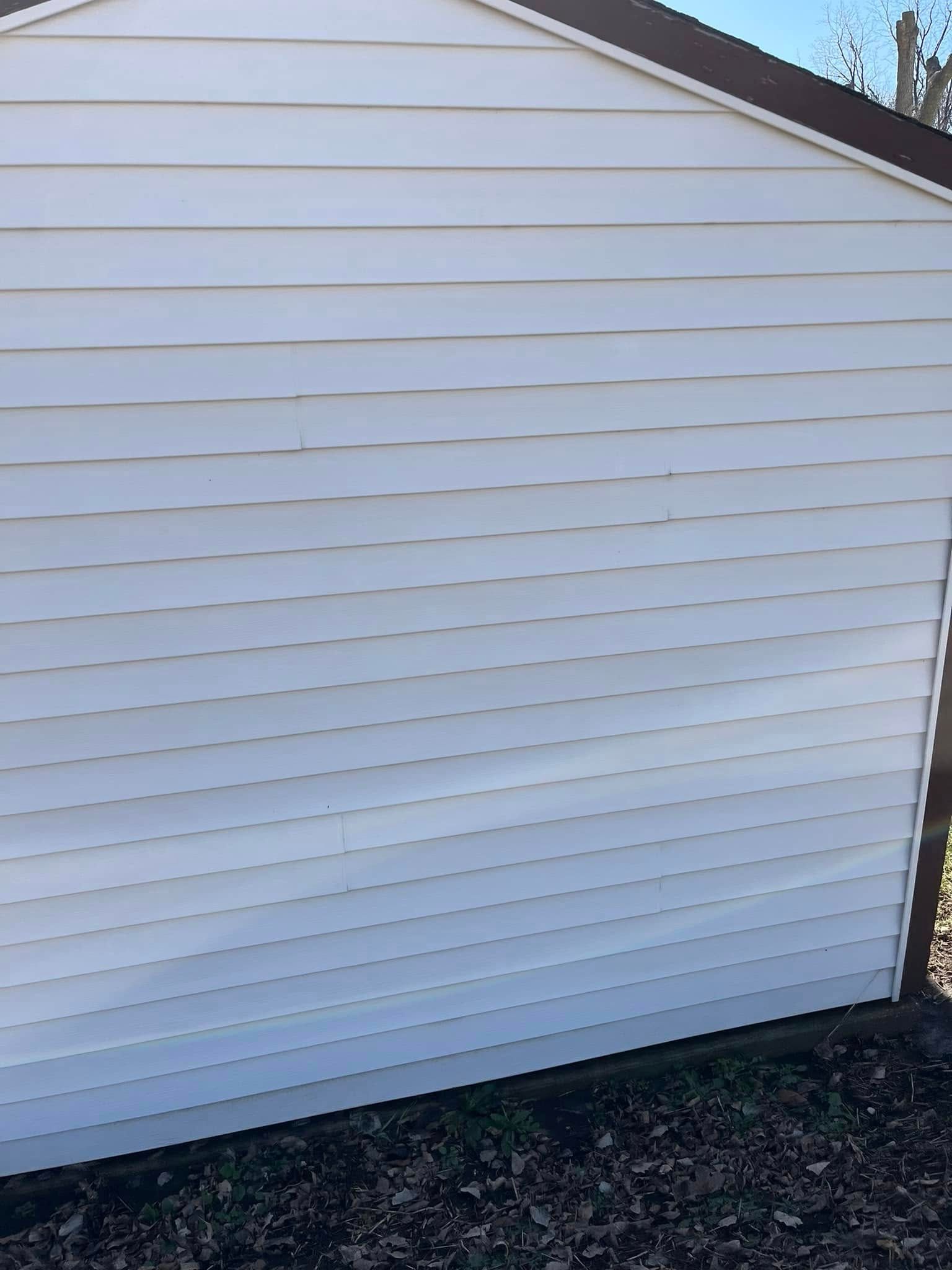 A white siding on the side of a house.