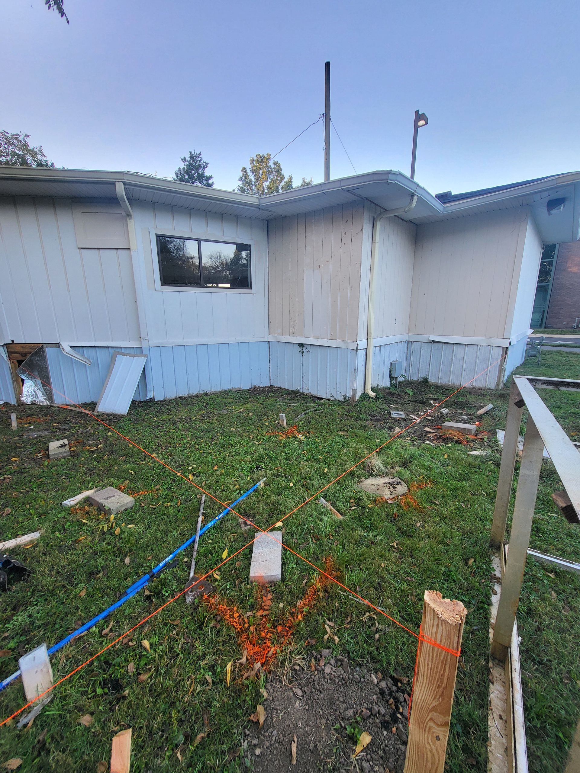 A house that has been damaged by a tornado is being demolished.