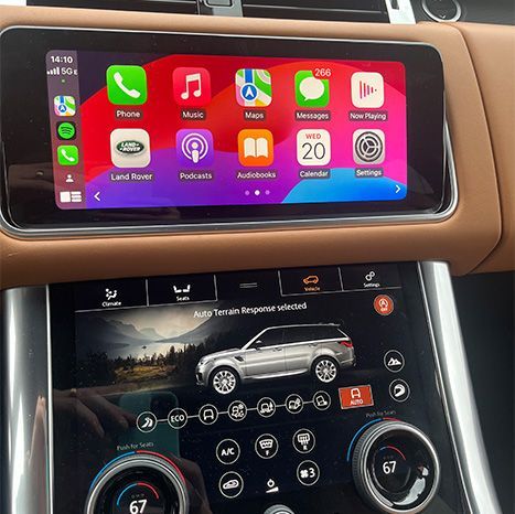 A car dashboard with a phone and a car on it.