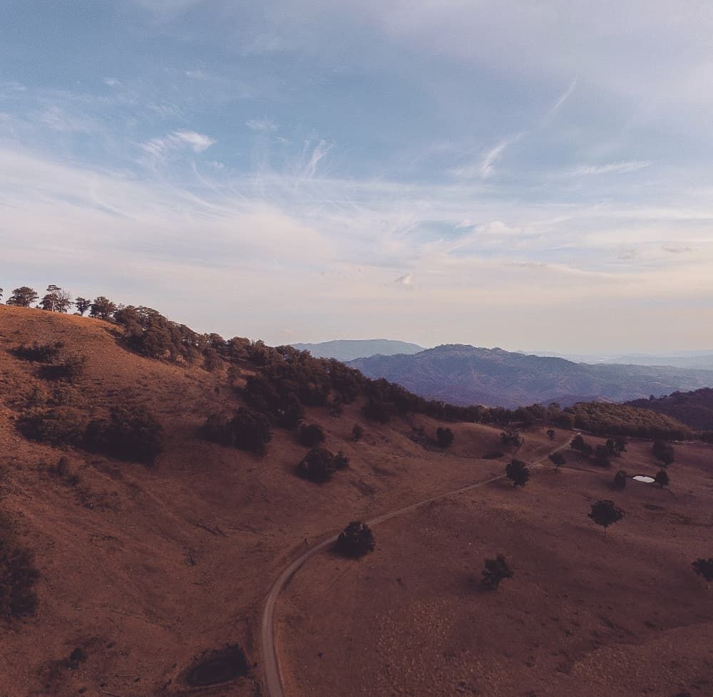 An Aerial View of A Dirt Road in The Mountains — Twin Lakes Towing & Recovery in East Maitland, NSW