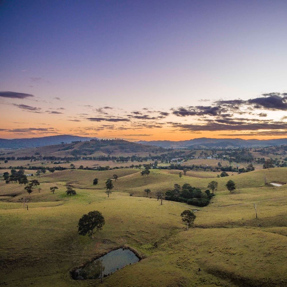 An Aerial View of A Landscape with A Sunset in The Background — Twin Lakes Towing & Recovery in Maitland, NSW
