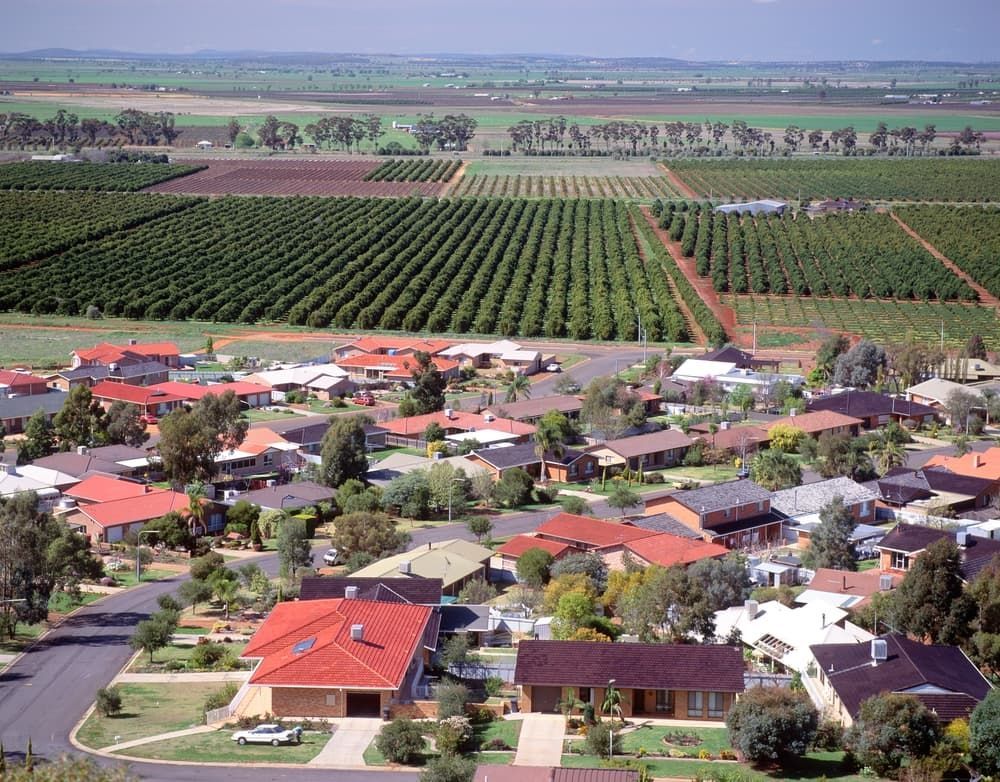 An Aerial View of A Residential Area with Trees and Fields in The Background — Twin Lakes Towing & Recovery in Beresfield, NSW