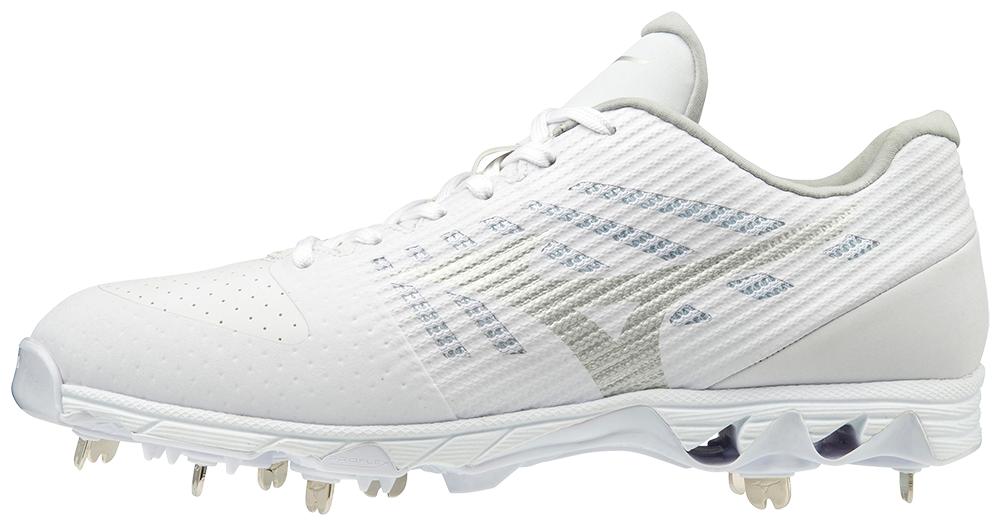 A pair of white baseball cleats with metal spikes on a white background.