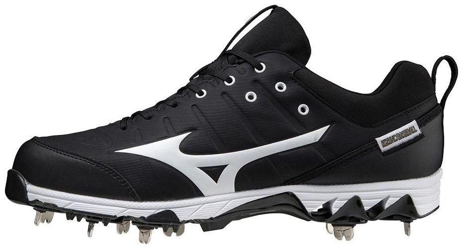 A pair of white baseball cleats with metal spikes on a white background.