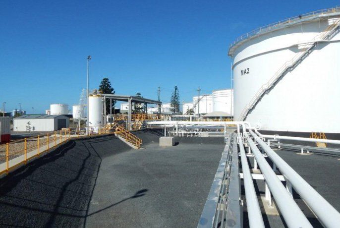 Outdoor White Tanks — Electricians in Mackay, QLD