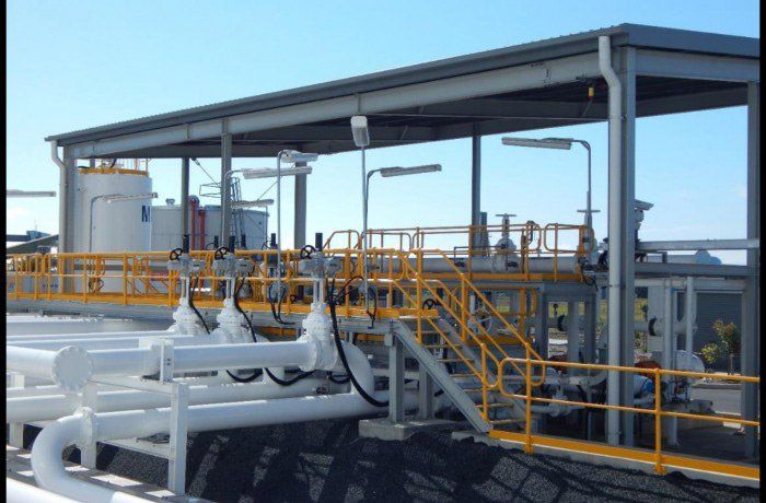 Power Plant With Yellow Barriers — Electricians in Mackay, QLD