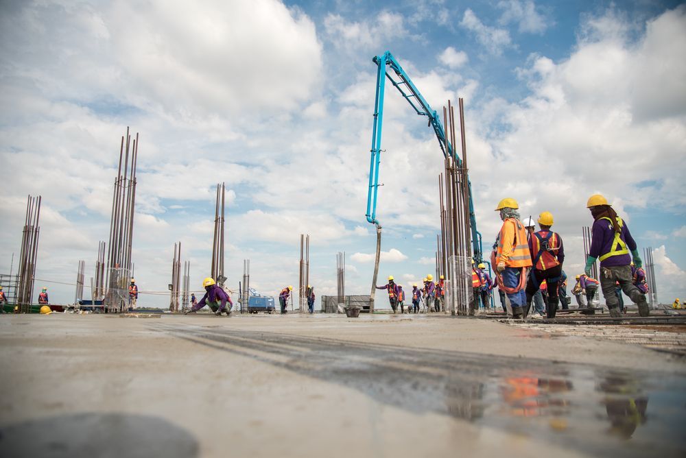 Construction Workers Pouring Concrete — East Point Earthmoving in Bangalow, NSW