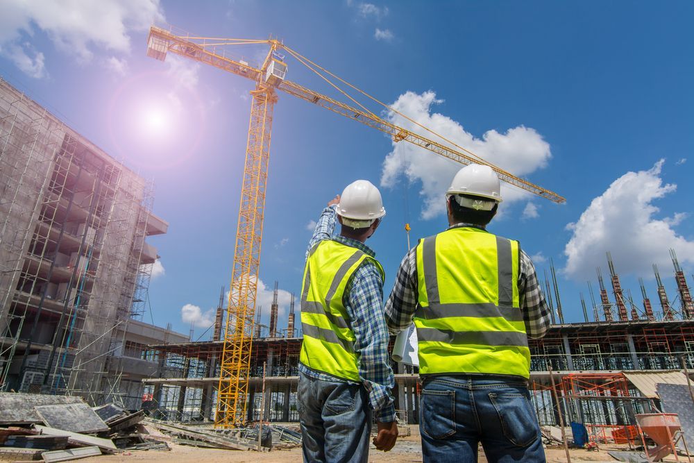 Two Construction Workers in Vests — East Point Earthmoving in Mullumbimby, NSW