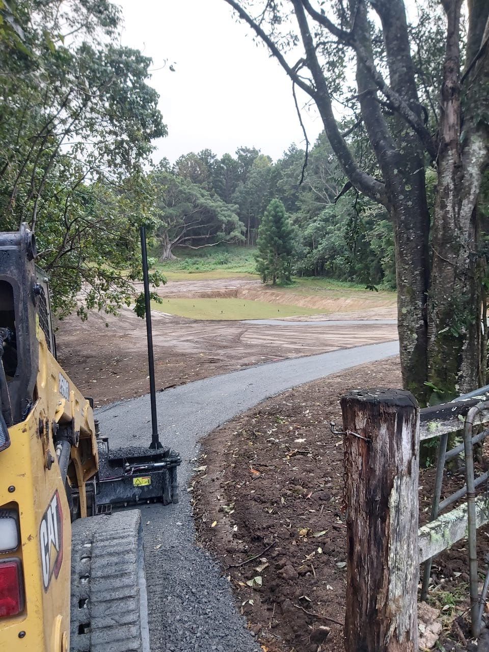 A Yellow Compactor Is Being Used To Push Asphalt — East Point Earthmoving in Bangalow, NSW