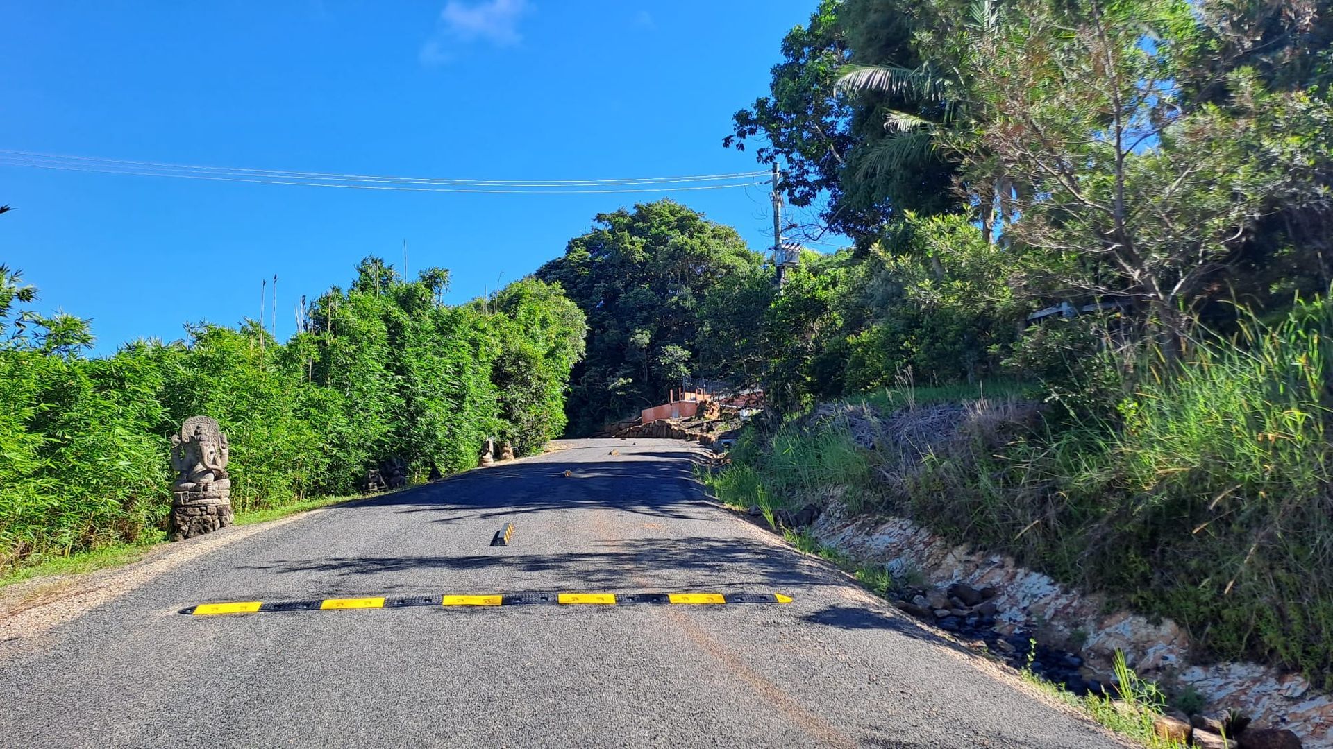 A Group Of Construction Vehicles Are Working On A Road — East Point Earthmoving in Byron Bay, NSW