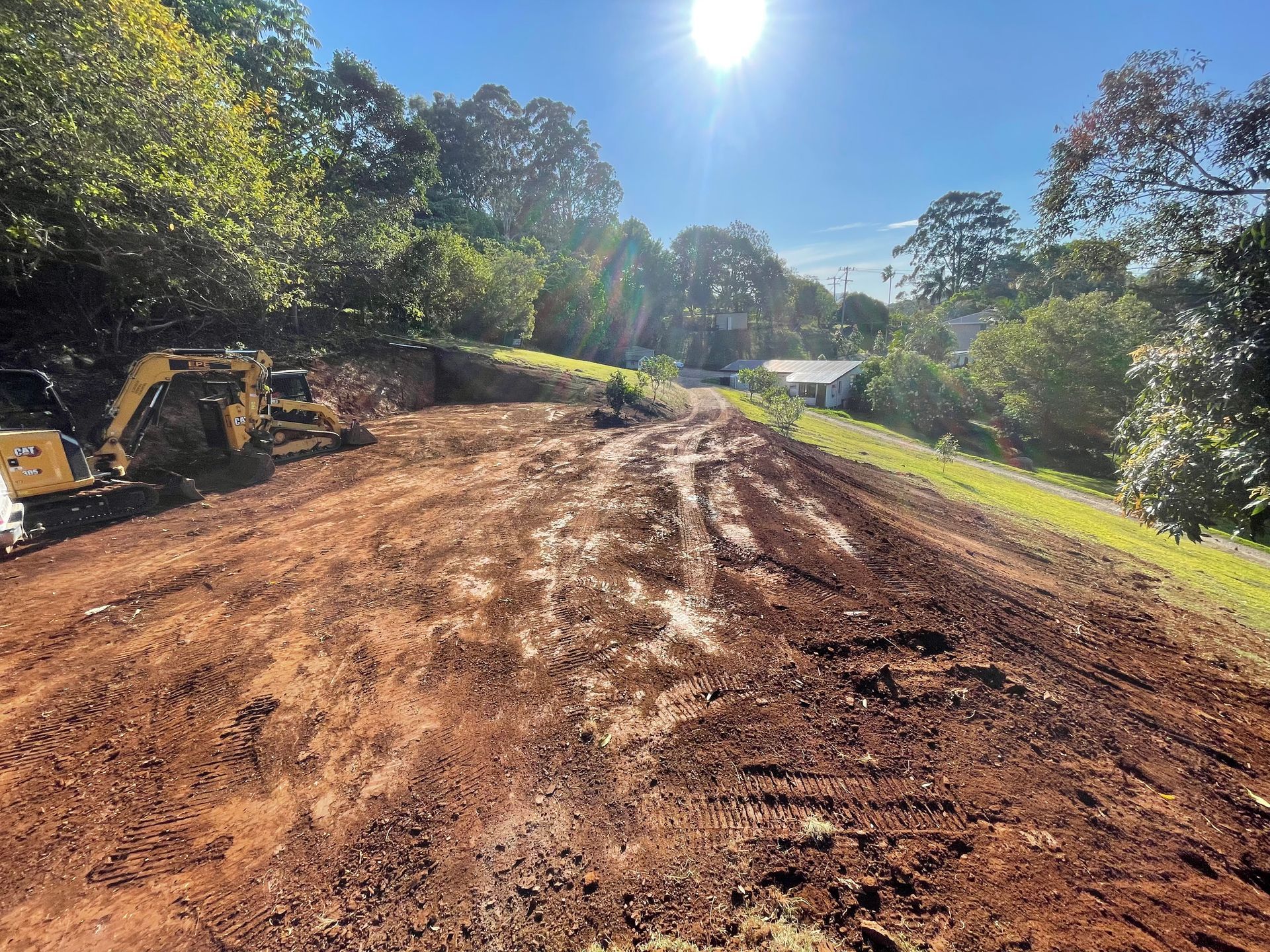 Two Bulldozers Are Working In A Dirt Field — East Point Earthmoving in Byron Bay, NSW