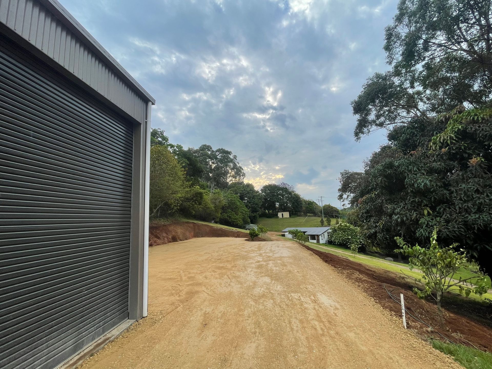 A Driveway Next To A Garage — East Point Earthmoving in Byron Bay, NSW