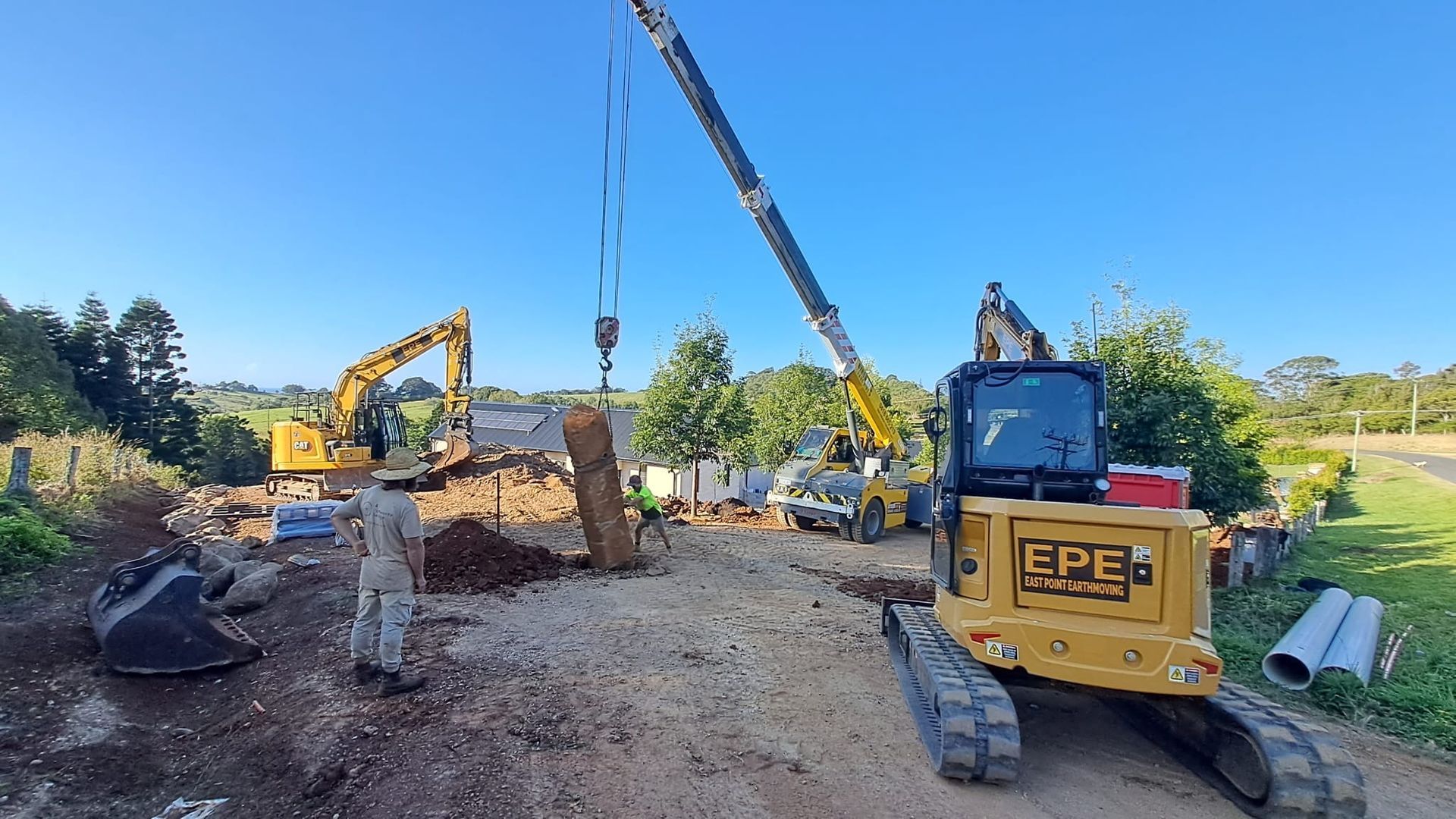 A Bulldozer Is Digging A Hole In The Ground — East Point Earthmoving in Brunswick Head, NSW