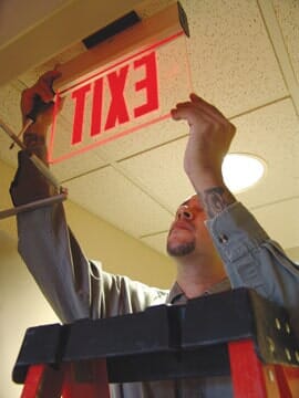 Installing Signage for Exit — Las Cruces, NM — RT Electric