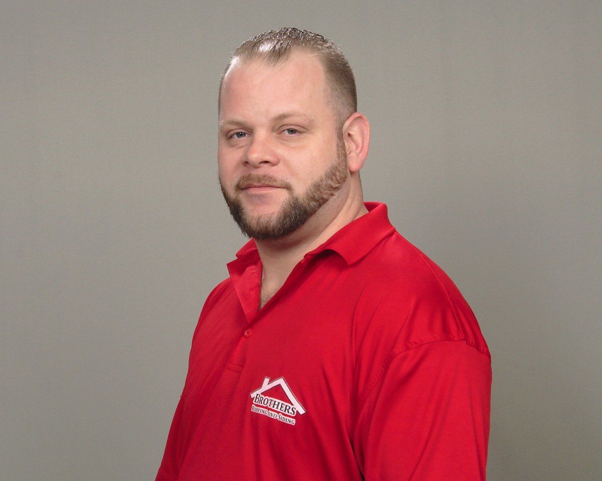 Man In Red Shirt — Warren, OH — Brothers Roofing & Siding