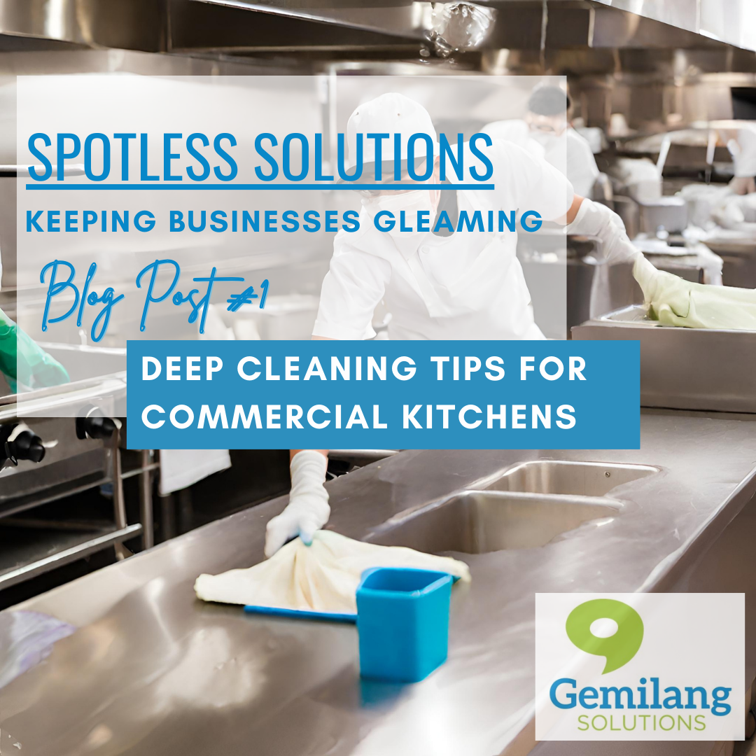 A person is cleaning a counter in a commercial kitchen. 