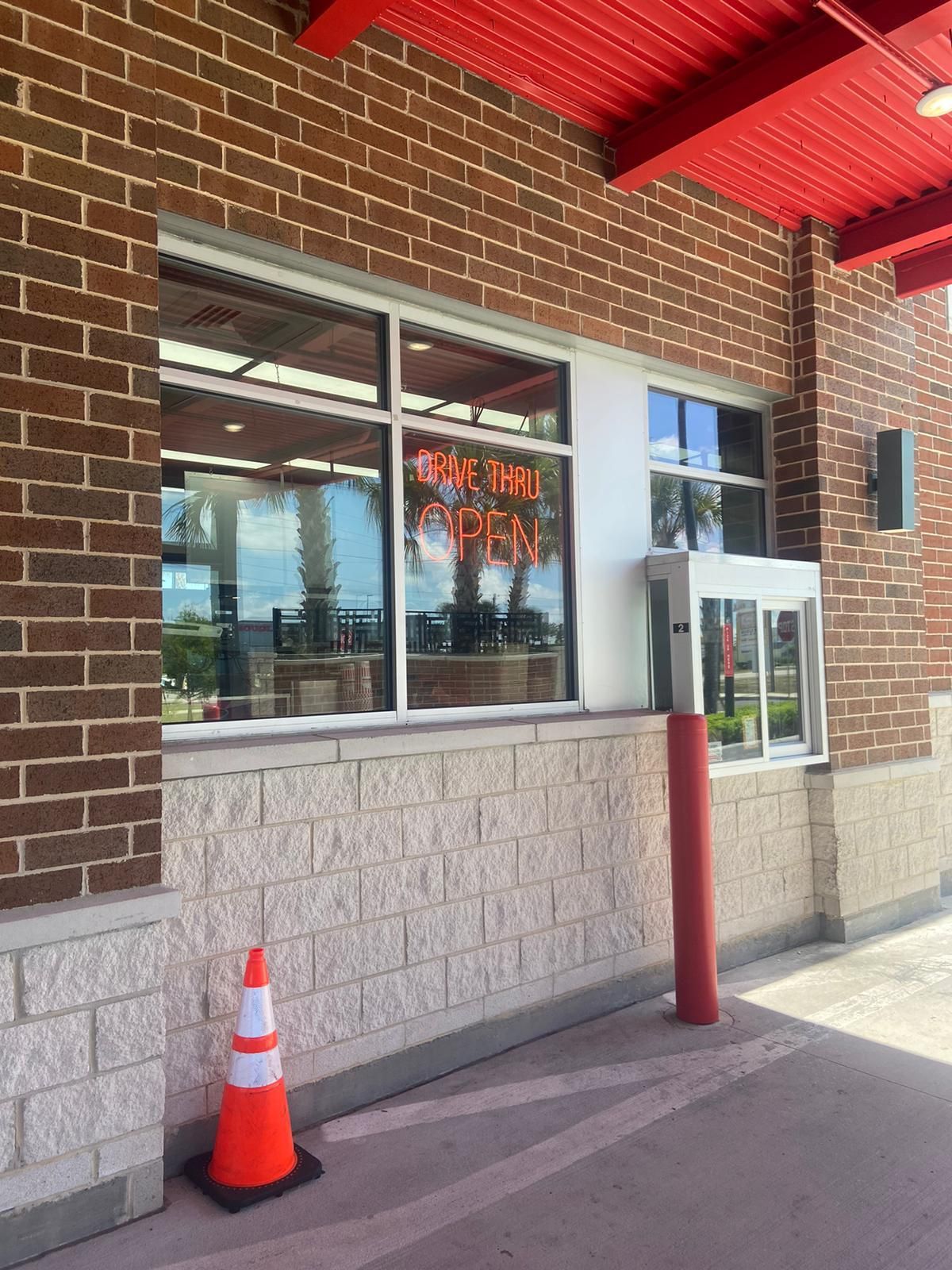 A brick building with a sign that says thursday on it