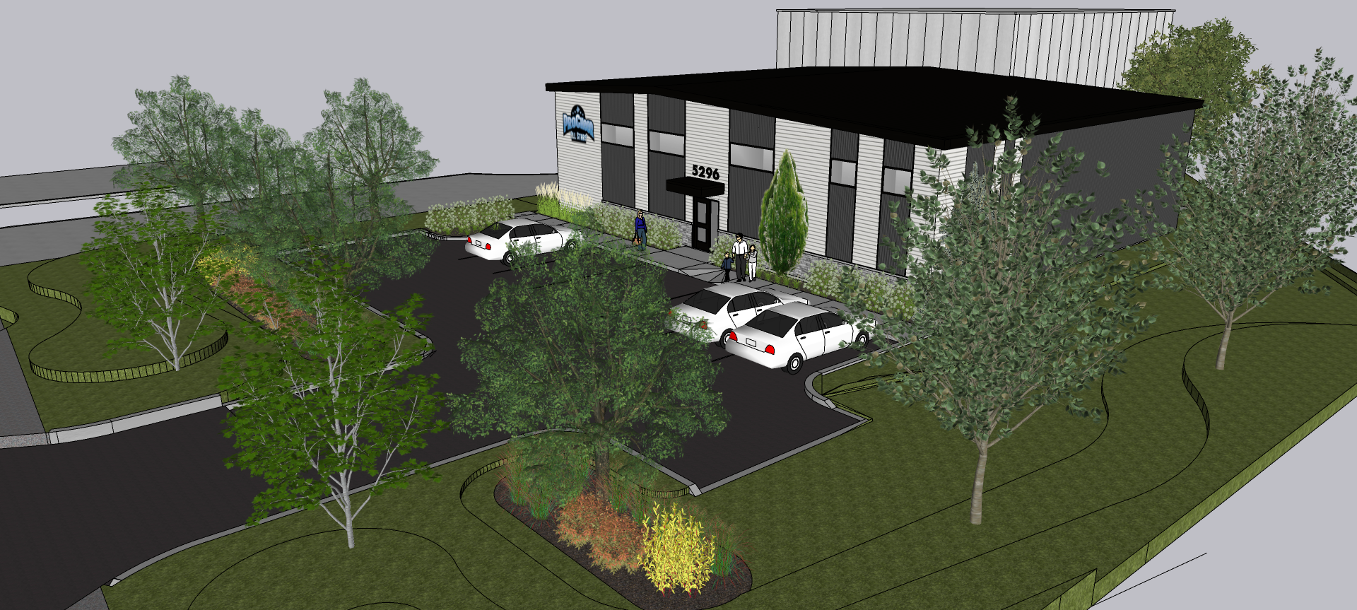 Une vue aérienne d'un bâtiment avec des voitures garées devant.