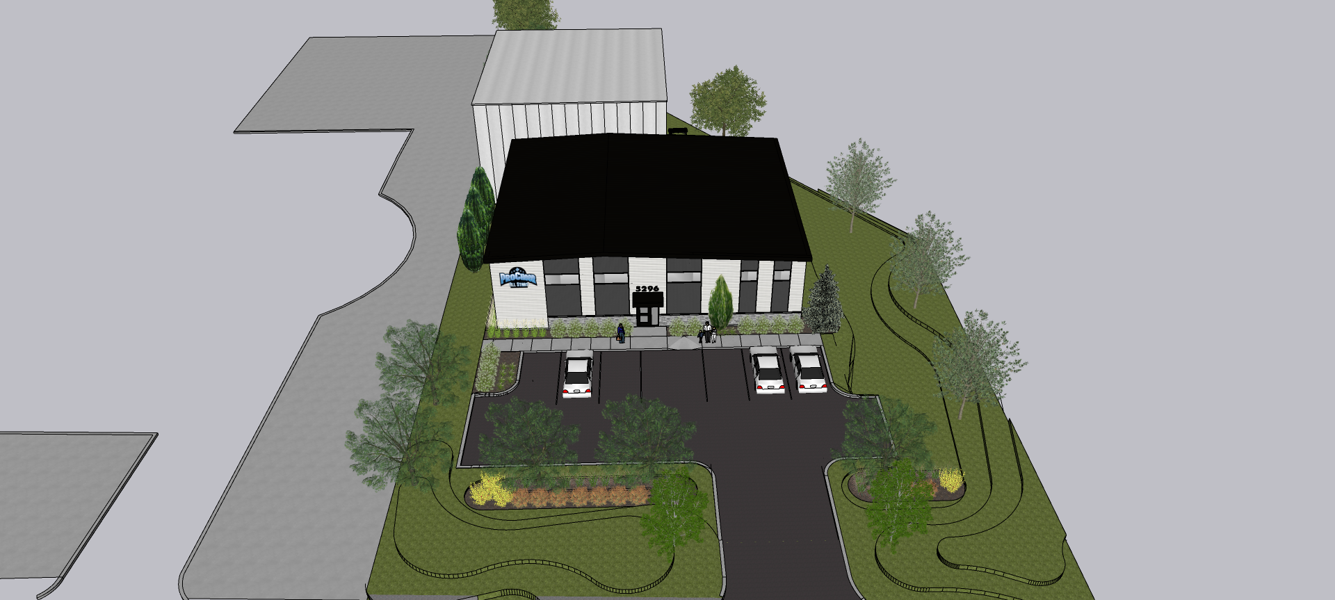 Une vue aérienne d'une maison avec un toit noir et une allée.