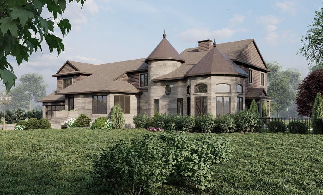 Une grande maison se trouve au milieu d'un champ verdoyant.