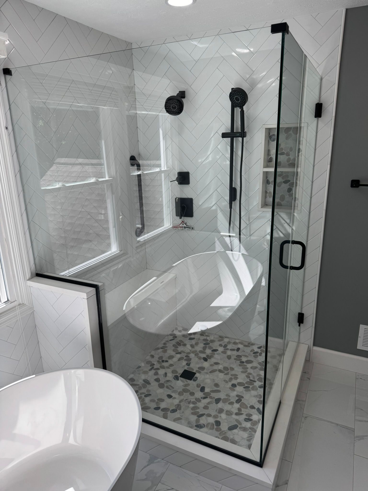 Spacious modern master bathroom Columbia, MD with contemporary double vanity and glass shower