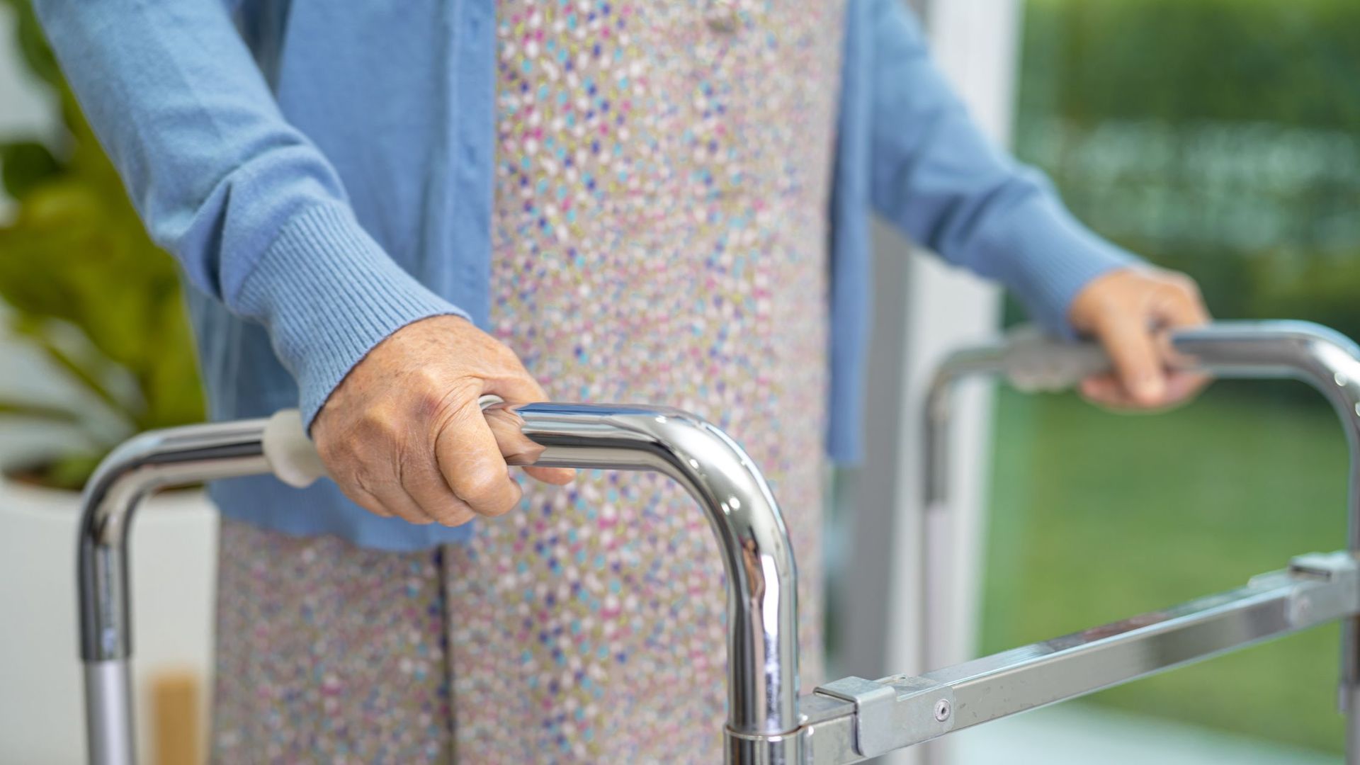 an older woman using a walker