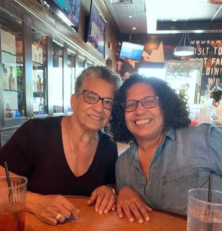 Irene and her mom at a restaurant