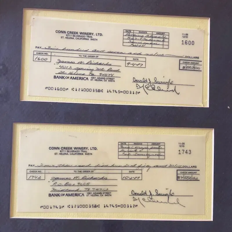 Two framed cheques from bank of america