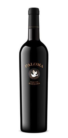 A bottle of paloma wine with a bird on the label