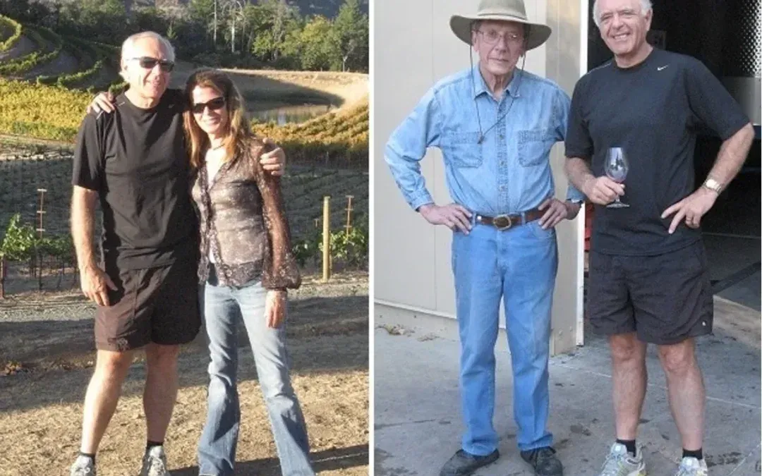 Two men and a woman are posing for a picture