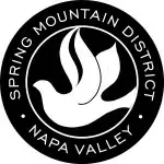 The logo for spring mountain district napa valley is a white dove in a black circle.
