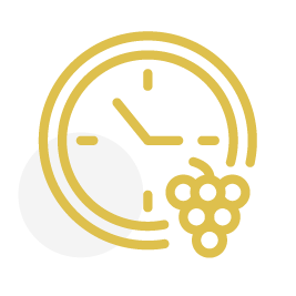 An icon of a clock and a bunch of grapes.