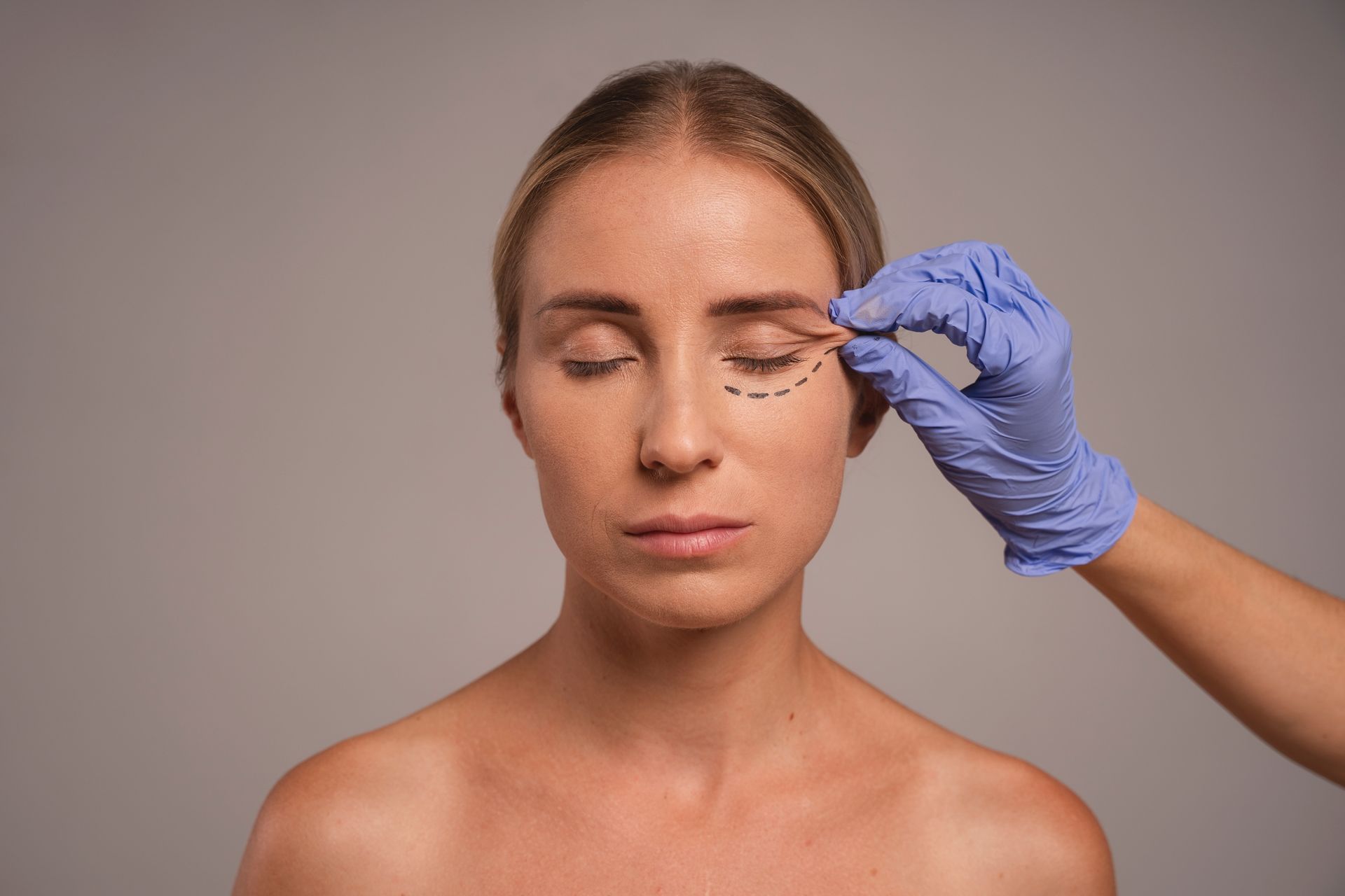 A woman is getting a botox injection in her eye.