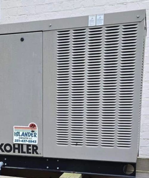 A kohler appliance is sitting in front of a brick wall