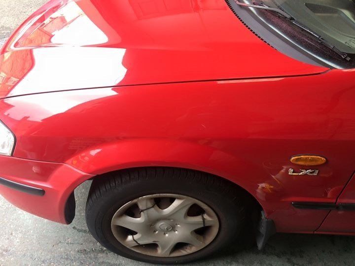 Left corner of a red car