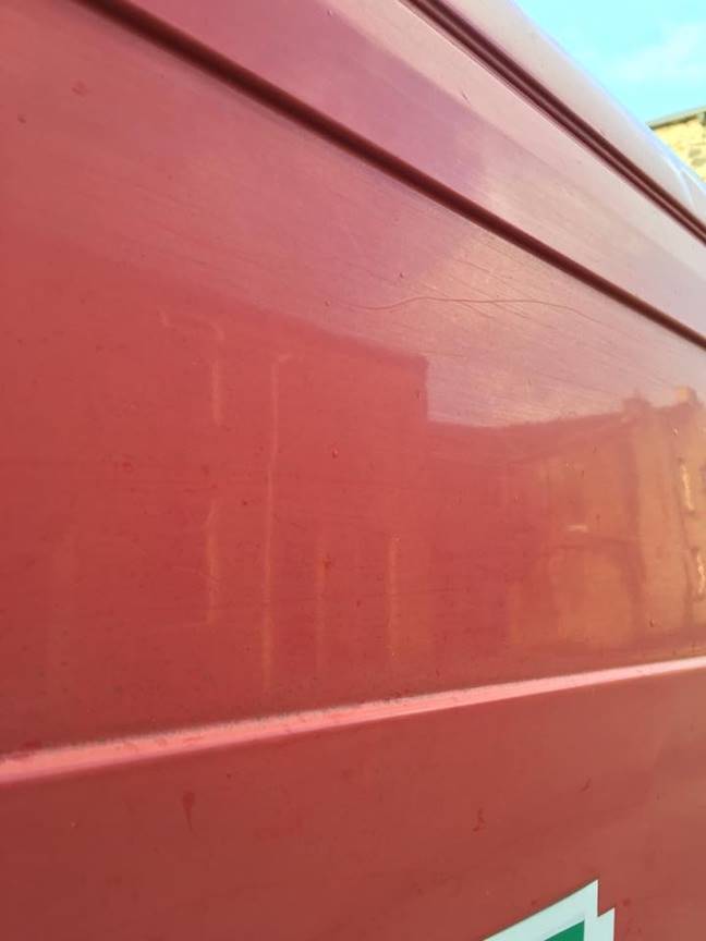 Close up shot of a red van's side