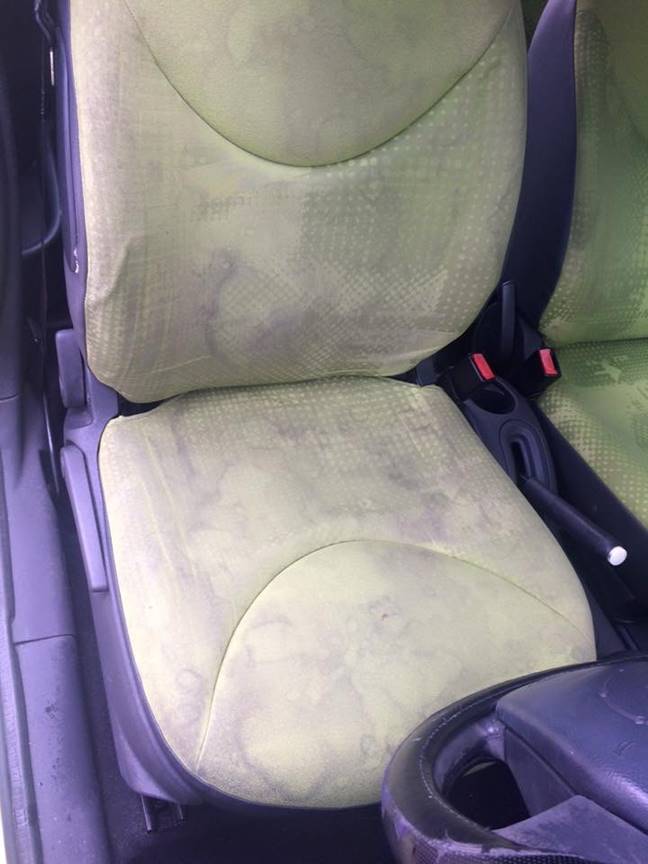 Old dirty driver's seat with purple sides